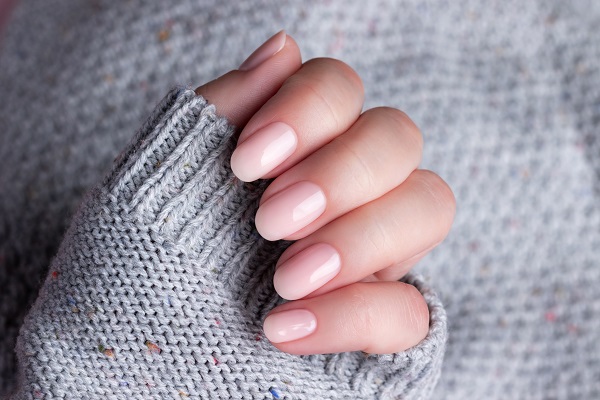 hand in sweater with nude nails 2022 09 30 03 16 09 utc 1