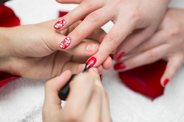 manicure closeup of beautiful woman hands polishi 2022 12 29 03 13 19 utc 2